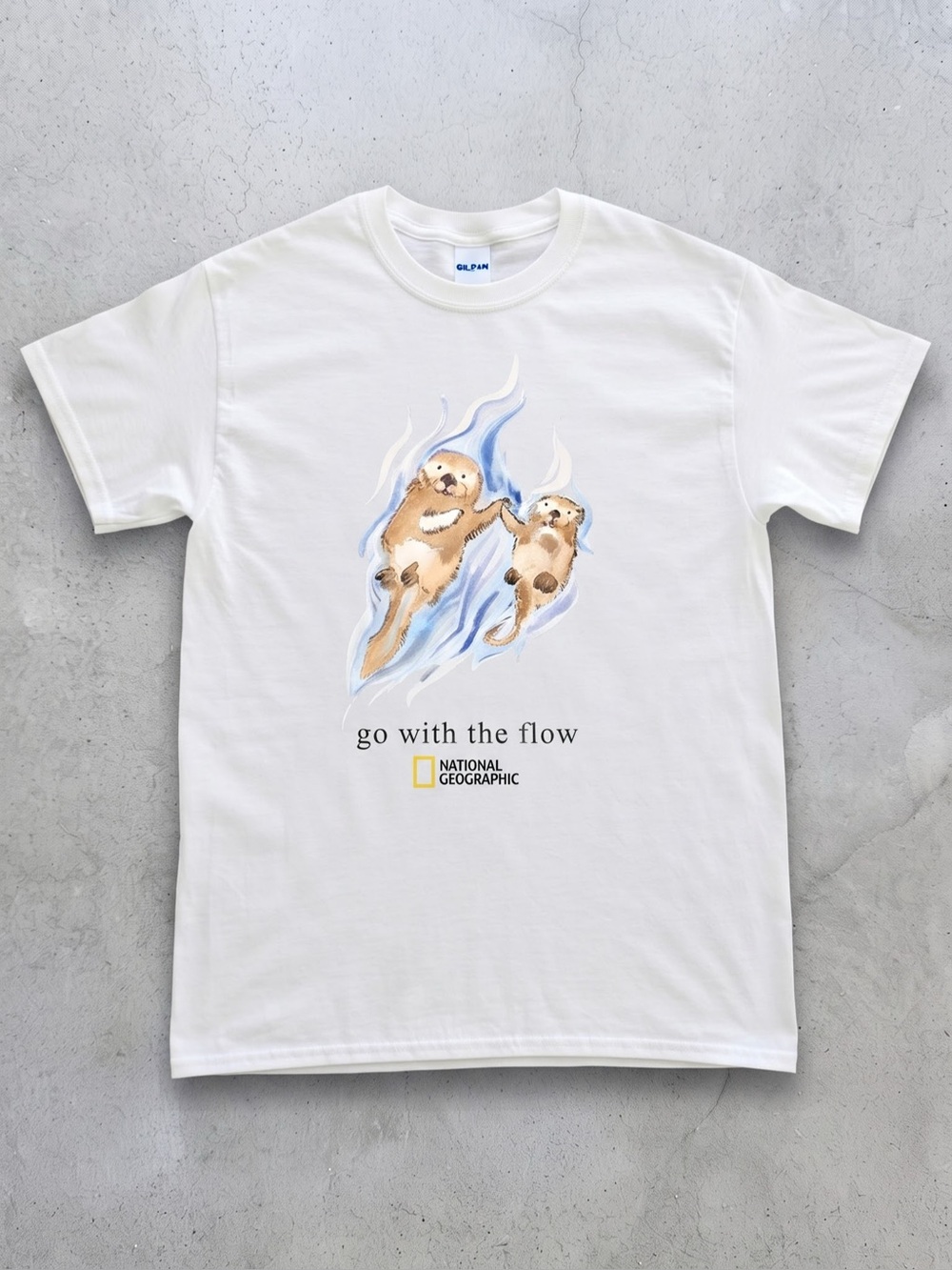 Cute Sea Otters Graphic Tee -
"Go With The Flow" Vintage White T-Shirt (Gildan)